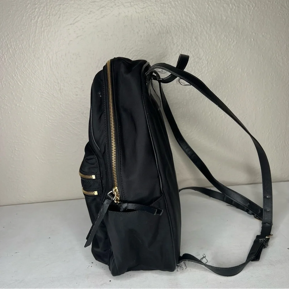 Kate Spade black gold zippers back pack